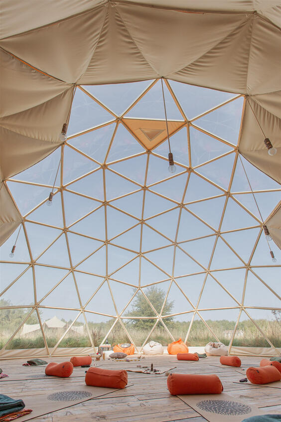Close-up brand photo of a chiropractor’s hands typing on her laptop.