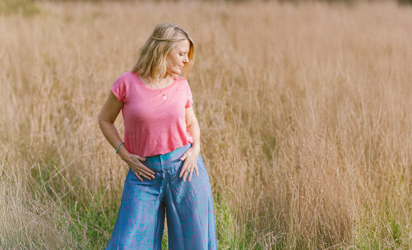 Wellness practitioner branding photoshoot in Lincolnshire field, natural light portrait.