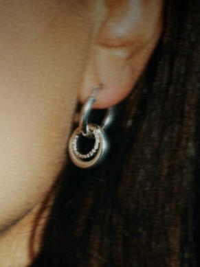 Close-up product detail: silver jewellery photographed during branding session.
